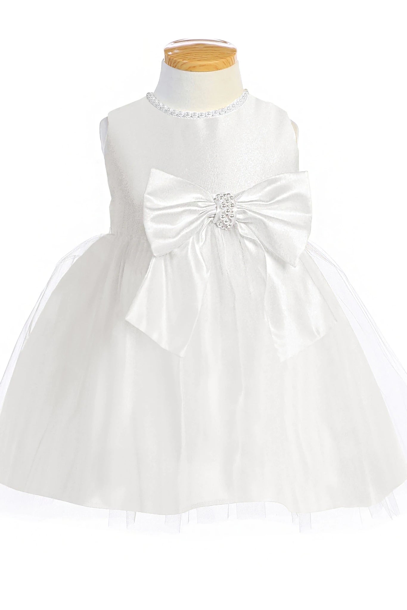 White flower girl dress with a large bow.
