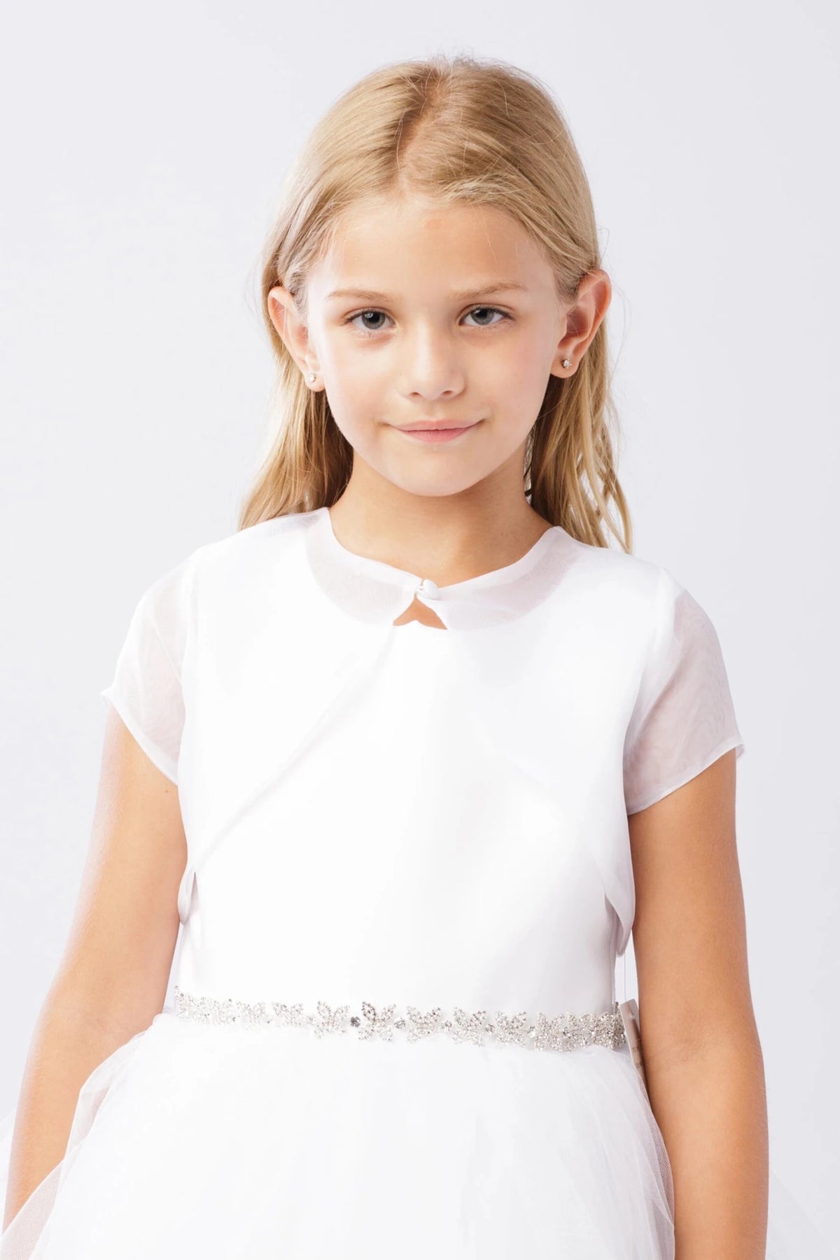 White organza bolero jacket with short sleeves and a bridal button closure.