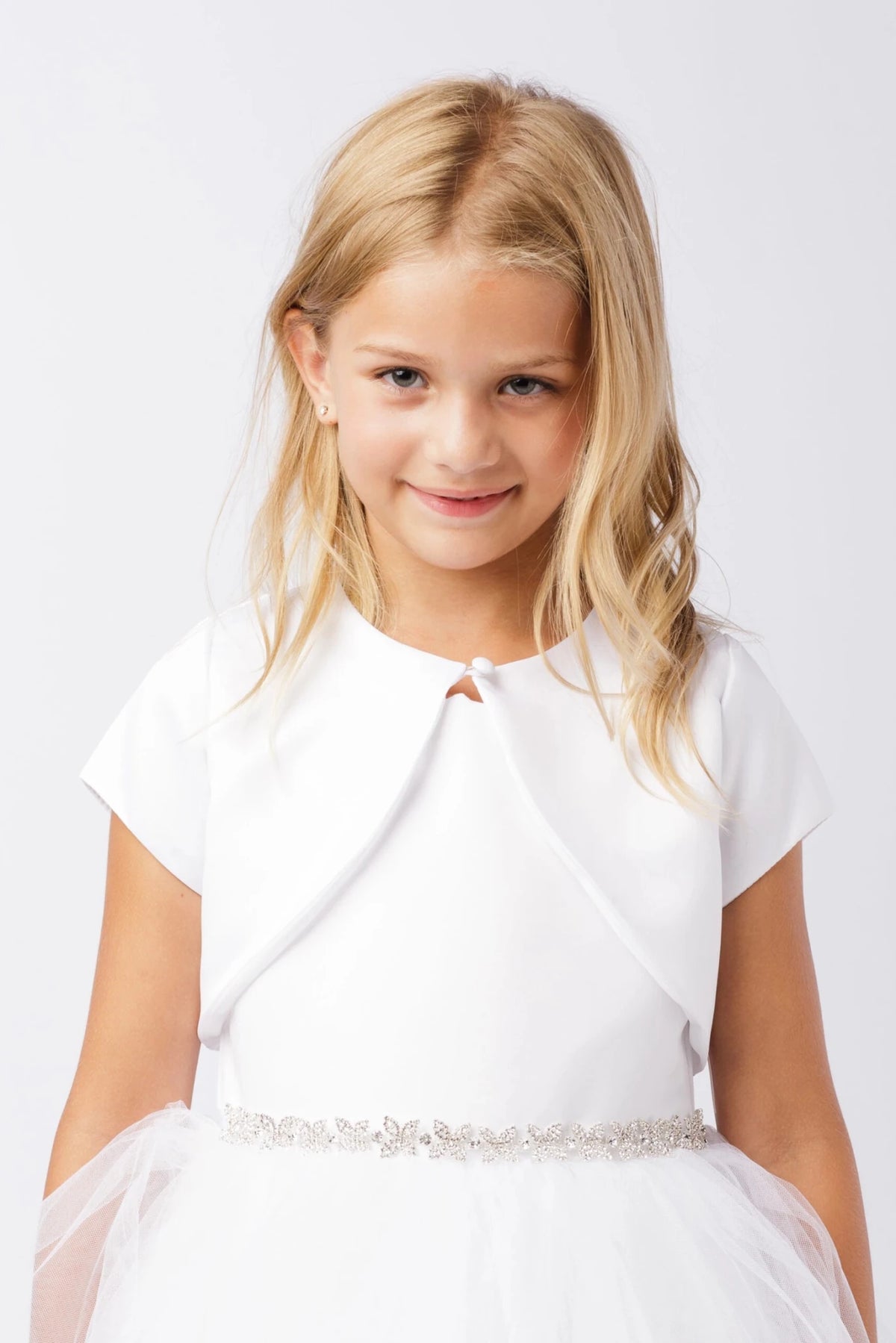 White satin bolero jacket with short sleeves and a bridal button closure.