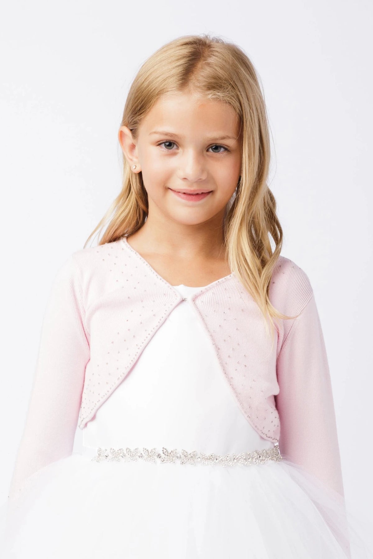 Pink knit bolero cardigan with long sleeves and delicate beadwork.