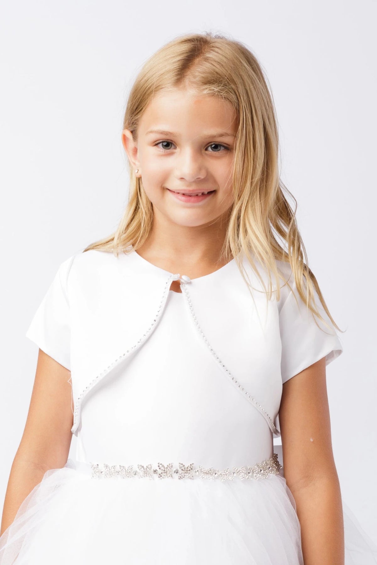 White satin bolero jacket with short sleeves and rhinestone trim.