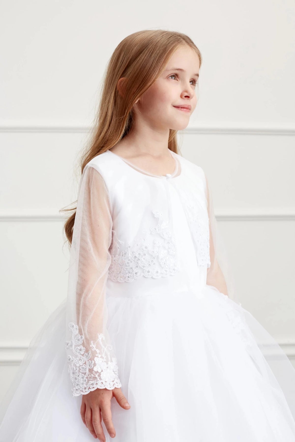 Lace appliqué finishes the long sleeves of the White bolero jacket.