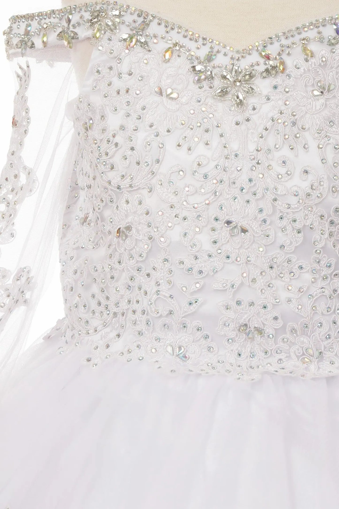 Rhinestones detail of a white kids mini quinceanera dress with AB stones glitter tulle fabric and scattered floral appliques