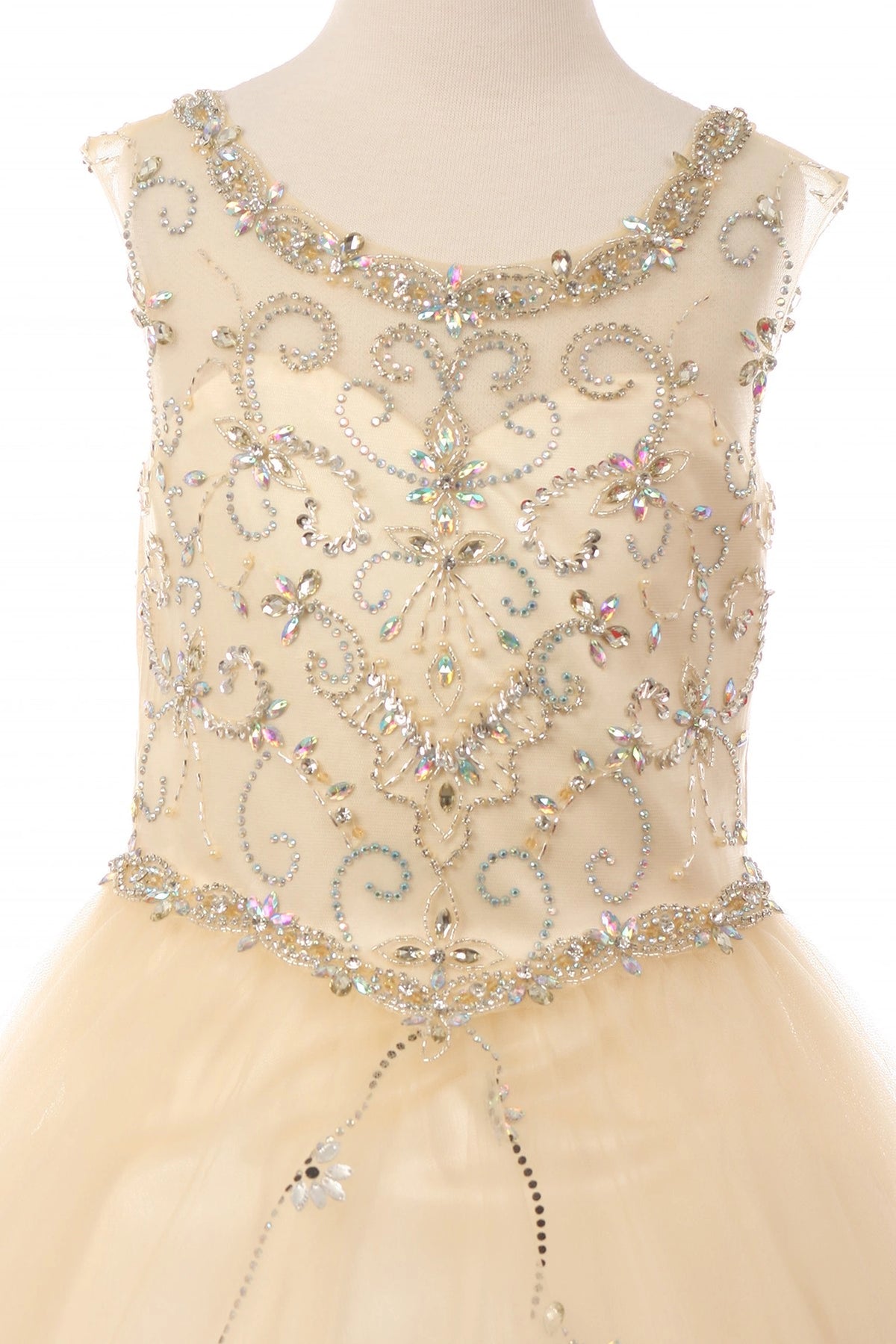 Details of the Blush kids dress show rhinestone floral scrollwork on the bodice.