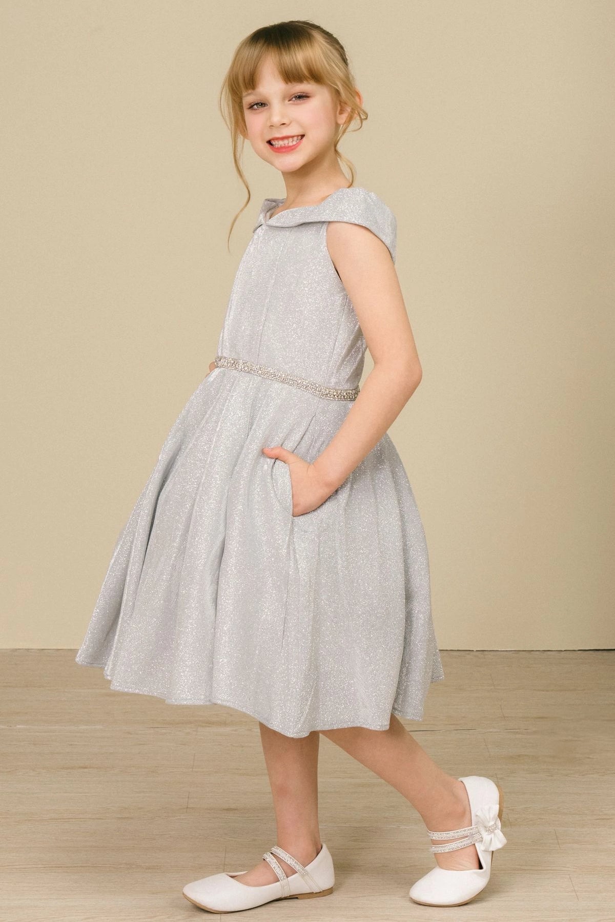 Accented a folded off-shoulder neckline adds character to this Silver kids party dress.