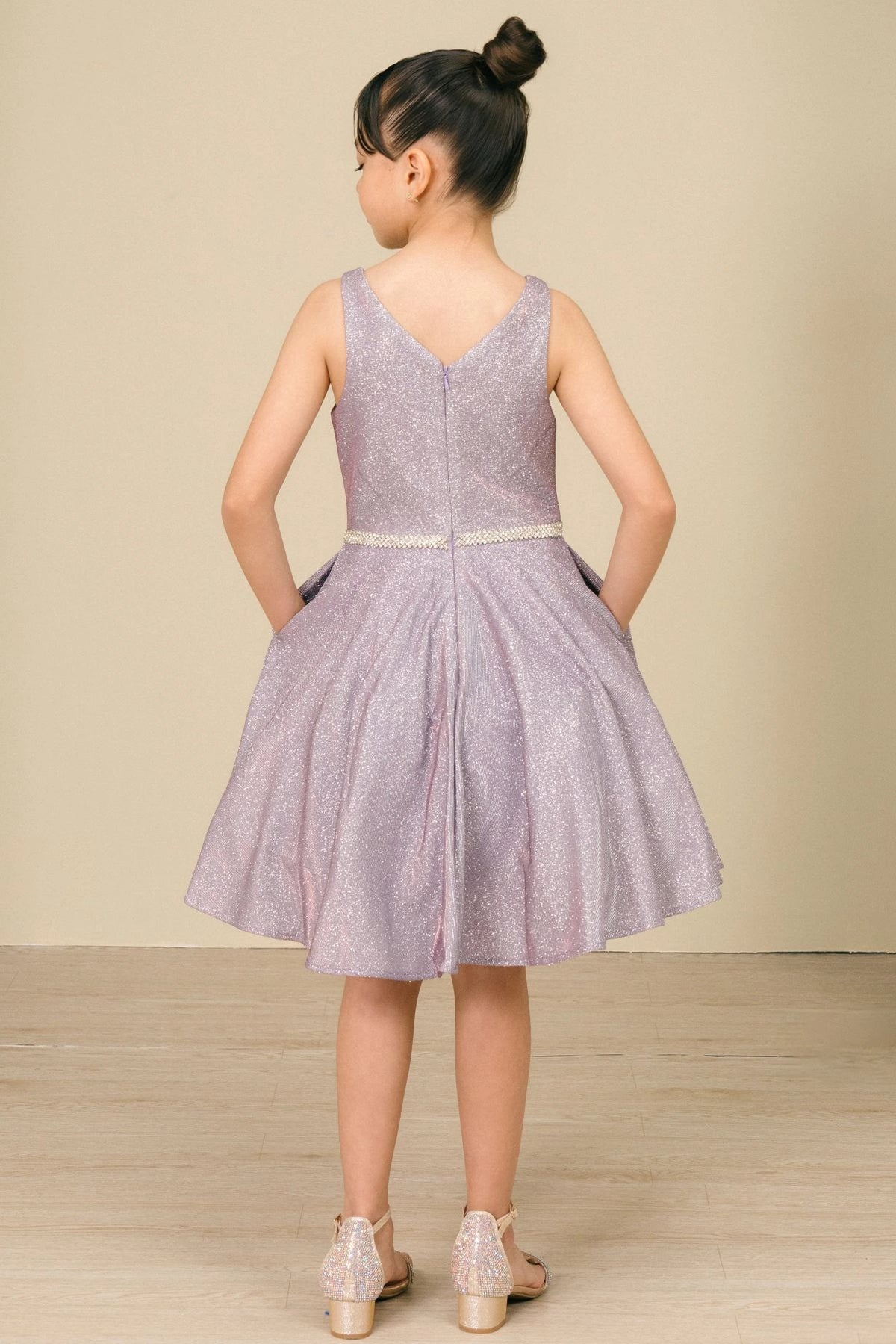 Finished details of a V-shaped back distinguish the Lilac kids party dress.