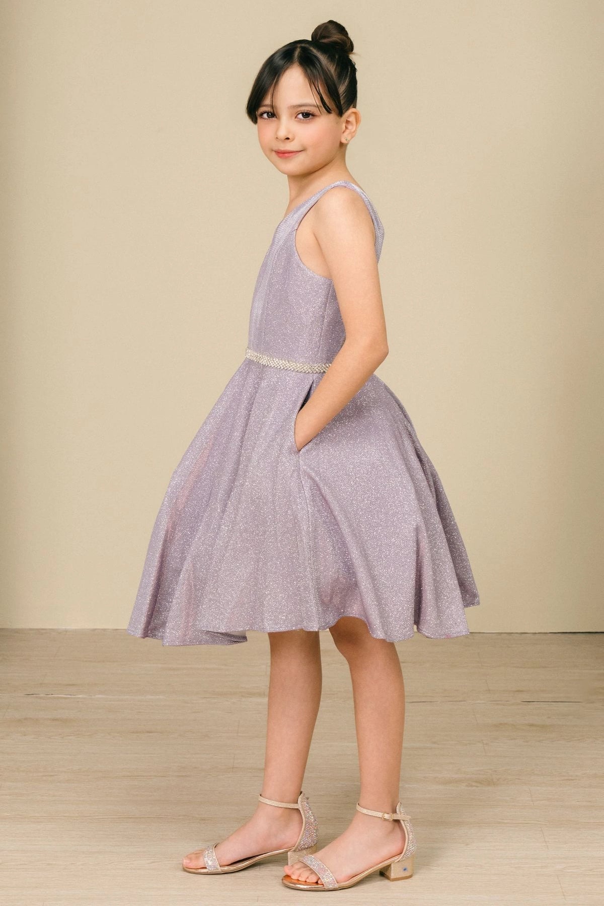 Accented a metallic V-neck bodice adds character to this Lilac kids party dress.