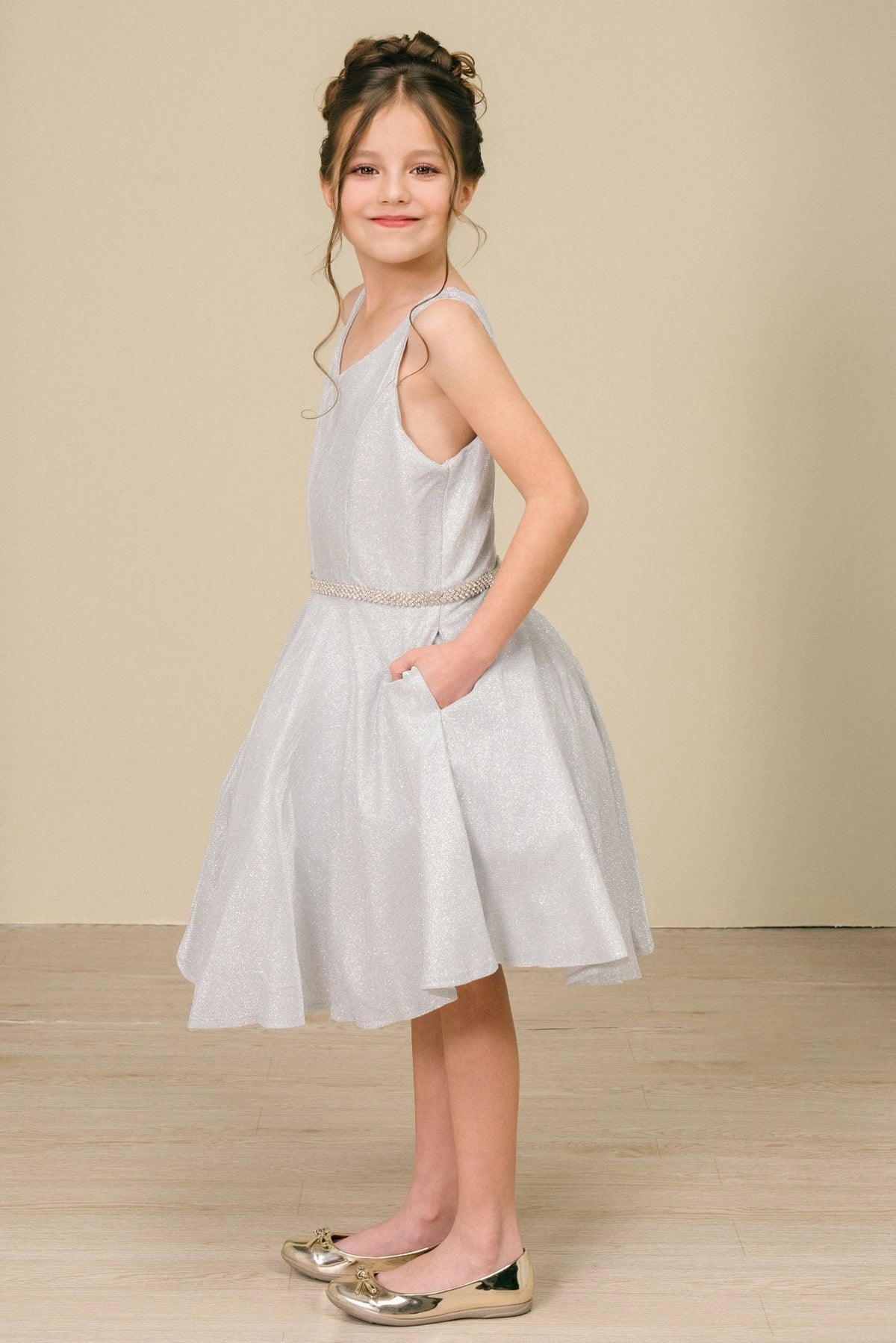 Featuring with a crystal-trimmed waistband, this Silver kids party dress displays elegant detail.