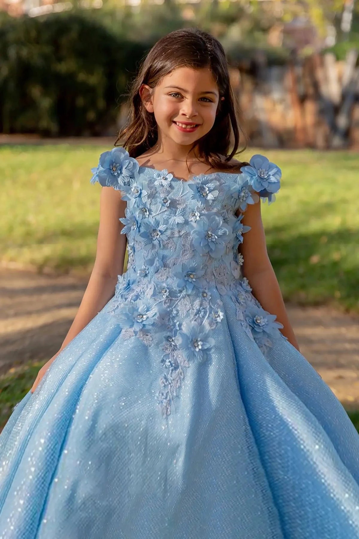 Blue front view kids mini quinceañera mini quince dress with 3D stone and pearl embellishments, fitted bodice and layered tulle skirt.