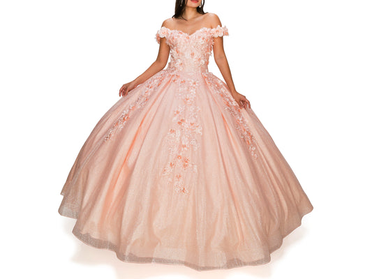 Blush Quinceanera | 6 Colors | 3D floral off-shoulder ball gown with glitter skirt, bottom pleated, corset back tie - front view of woman wearing dress with hands at sides