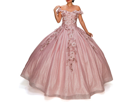 Dusty Rose Quinceanera | 6 Colors | 3D floral off-shoulder ball gown with glitter skirt, bottom pleated, corset back tie - front view of woman wearing dress with one hand on shouder