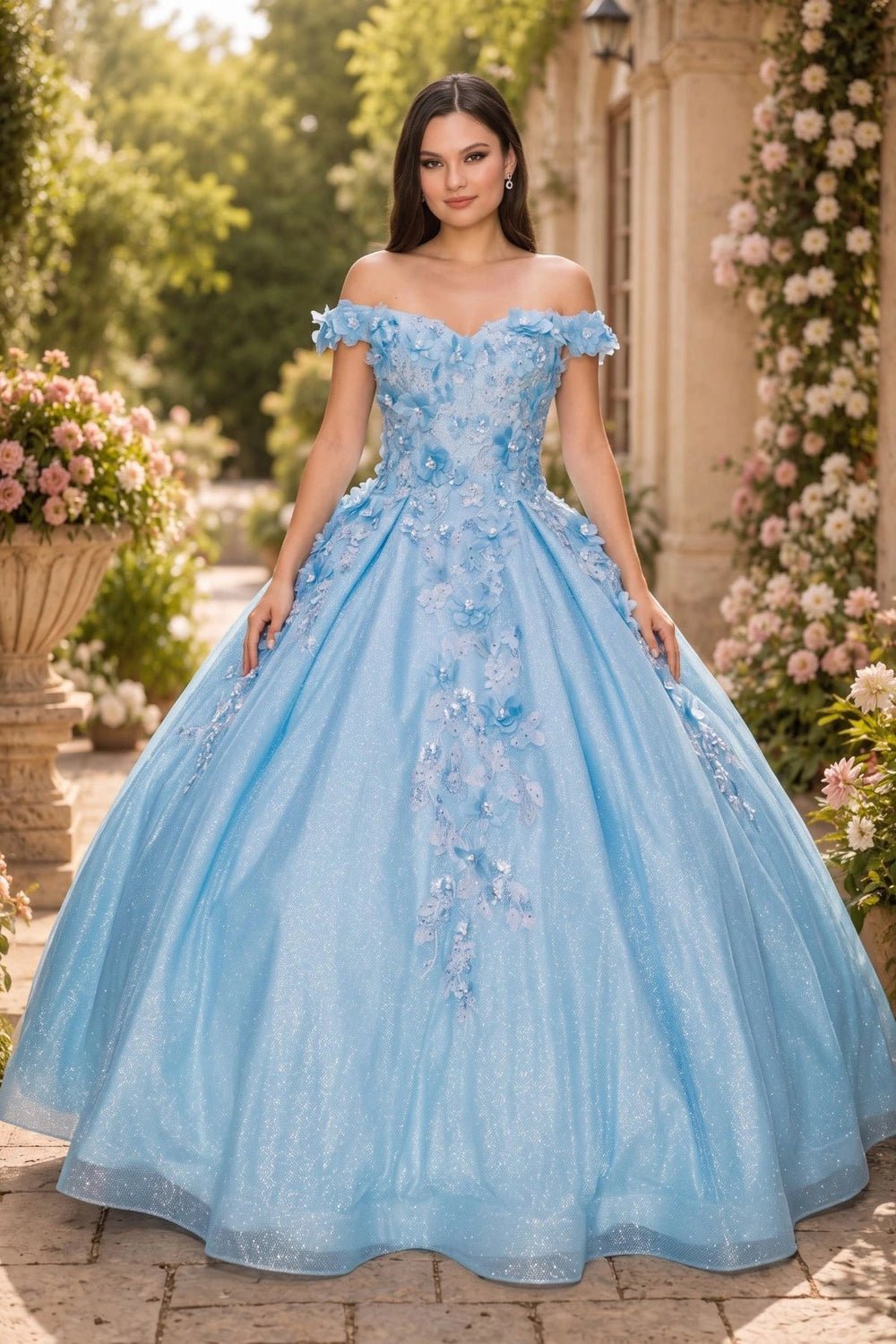 Shown in a front view, the Light Blue quinceañera dress has off-shoulder floral bodice and pleated glitter ball skirt.