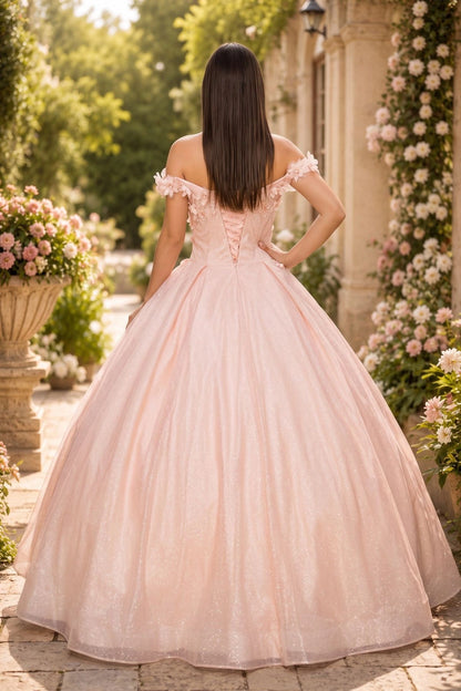 Displayed in a back view, the Blush quinceañera dress has lace-up back and full pleated glitter skirt.