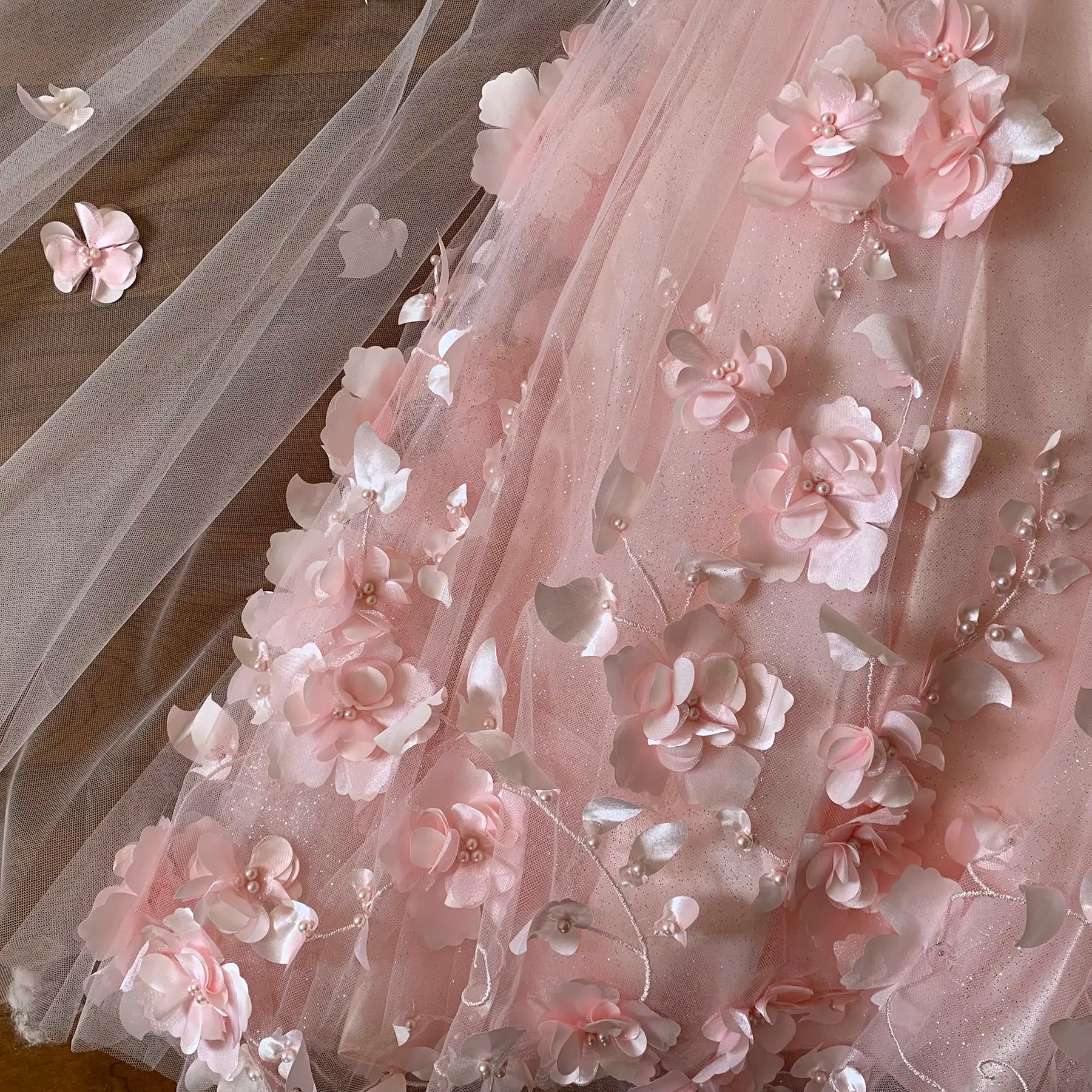 Blush Kids Dress with 3D Flowers, Stones, Pearls and Detachable Cape, Mini Quince Dress Close-up of a pink floral dress with intricate details
