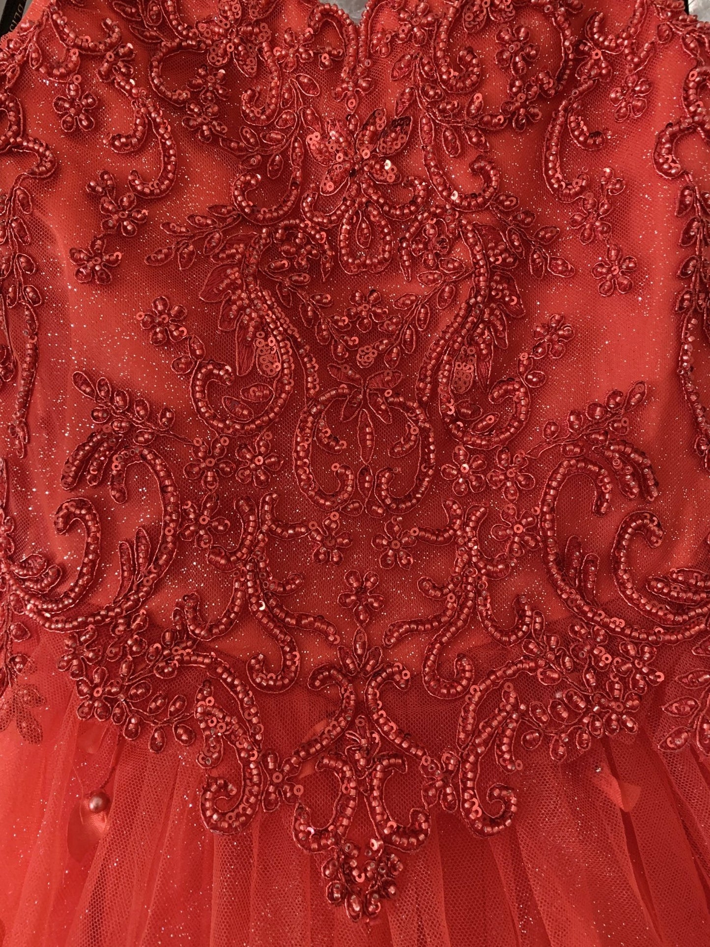 Red bodice close-up kids mini quinceañera mini quince dress with 3D floral applique, stones and pearl detailing.
