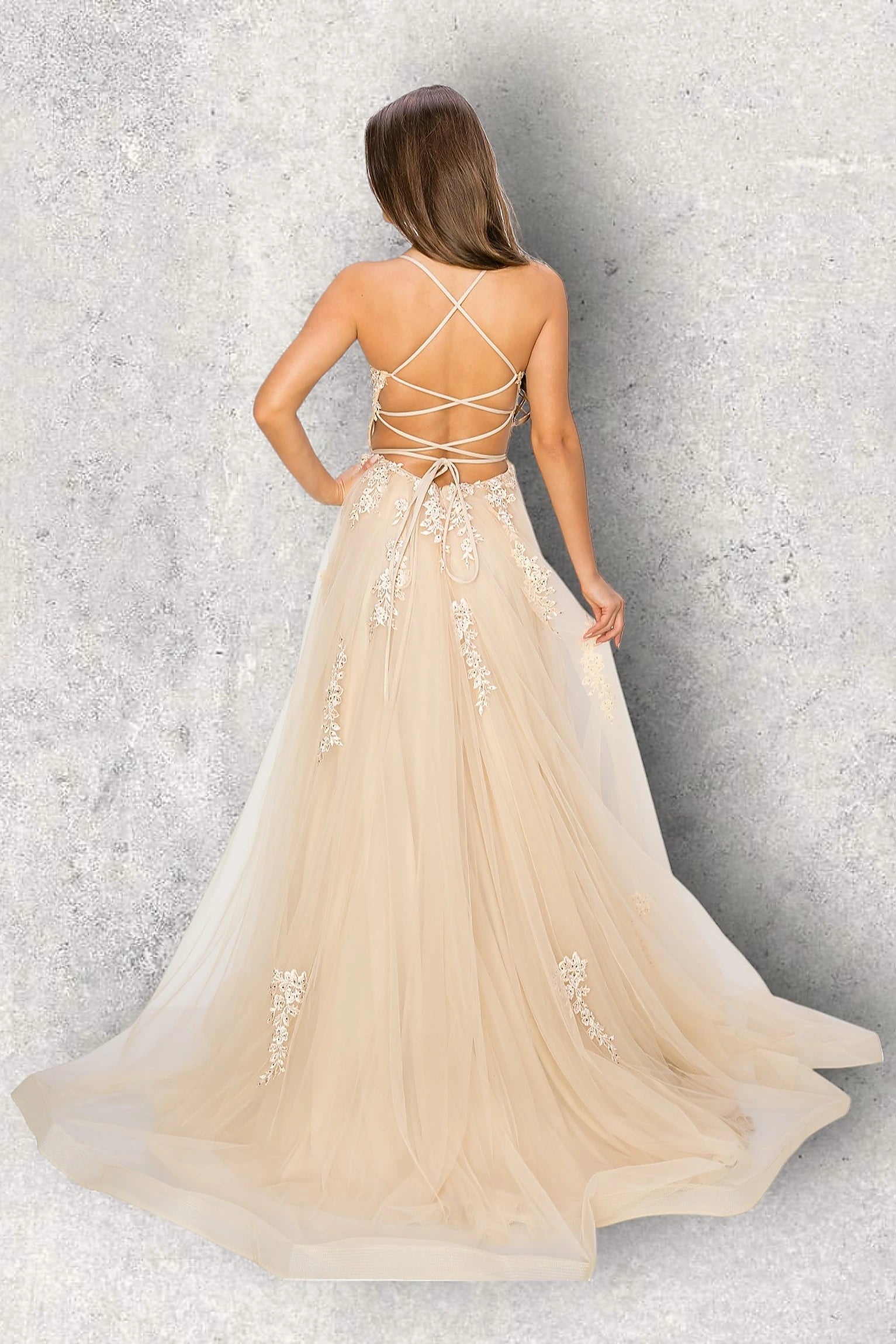 Champagne evening dress featuring thin straps and crisscross open back