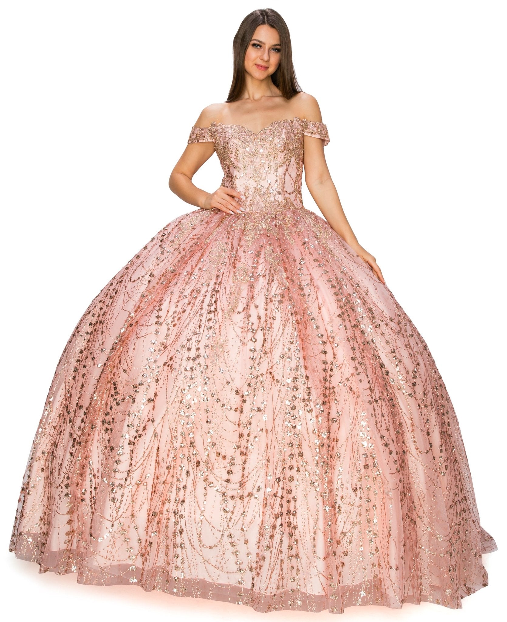 Front view of a woman wearing rose gold quinceanera ball gown with sweetheart neckline, gold embroidery, and glitter bodice