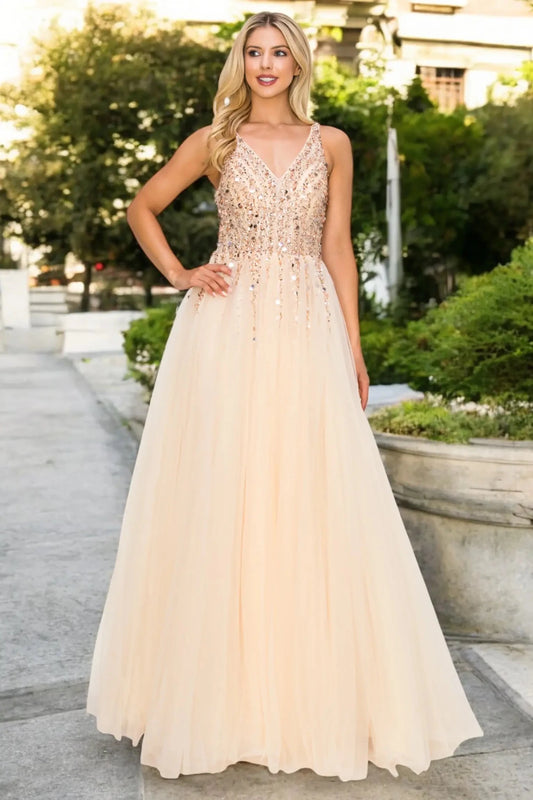 Full front view of a women wearing champagne lace evening prom dress with sequin and tulle skirt.