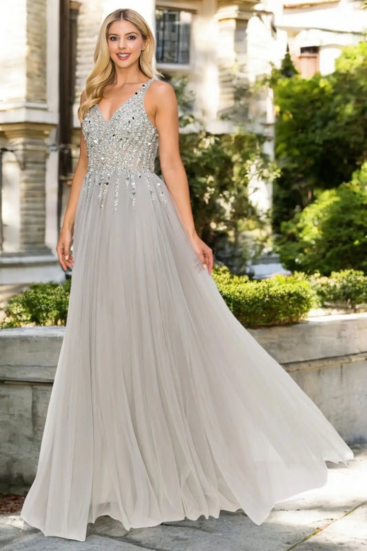 Full length- view of silver formal dress with open V-length- and flowing skirt.