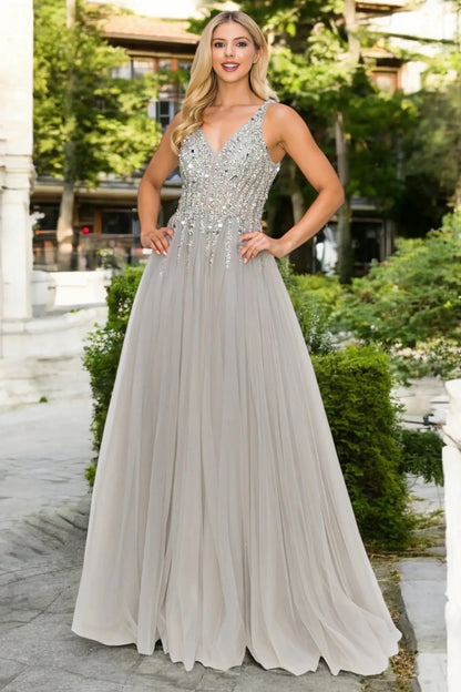 Full front view of a women wearing silver lace evening prom dress with sequin and tulle skirt.