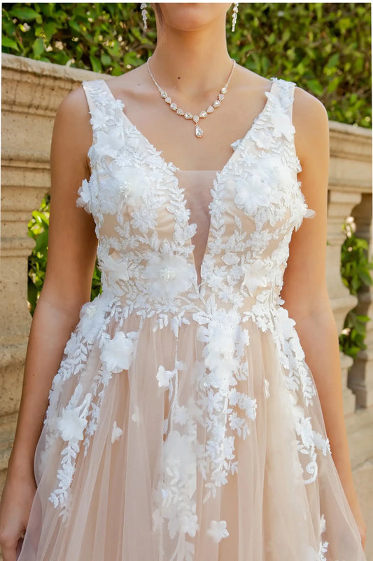 A close-up view of a woman wearing a champagne lace bodice with pearl beads and 3D organza floral detail.