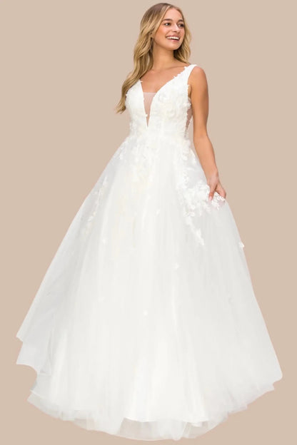 Full front view of a women wearing silver floral lace A-line prom dress with illusion V-neck bodice.