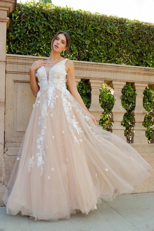 Woman in a beige champagne floral tulle gown