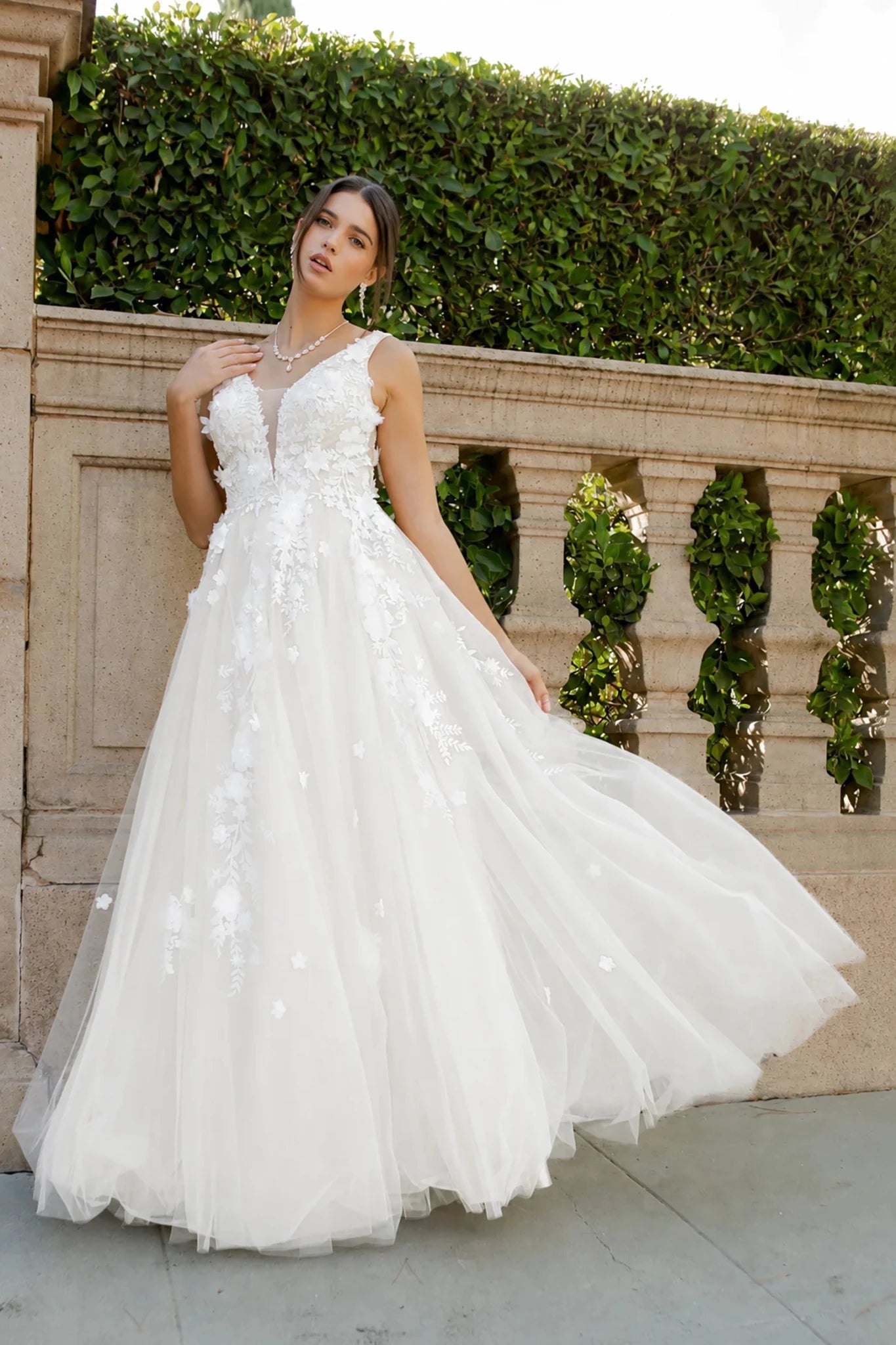 white A-line wedding with floral lace appliques and a sheer tulle skirt