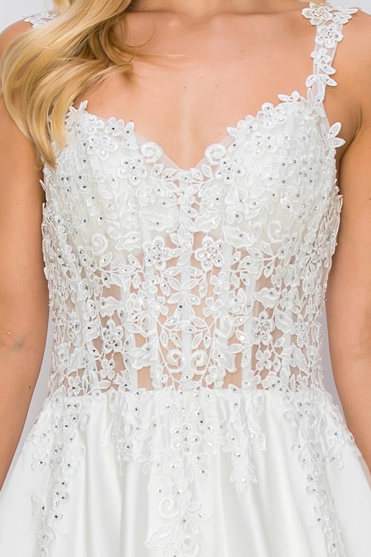 Ivory evening dress featuring floral appliques across sheer bodice