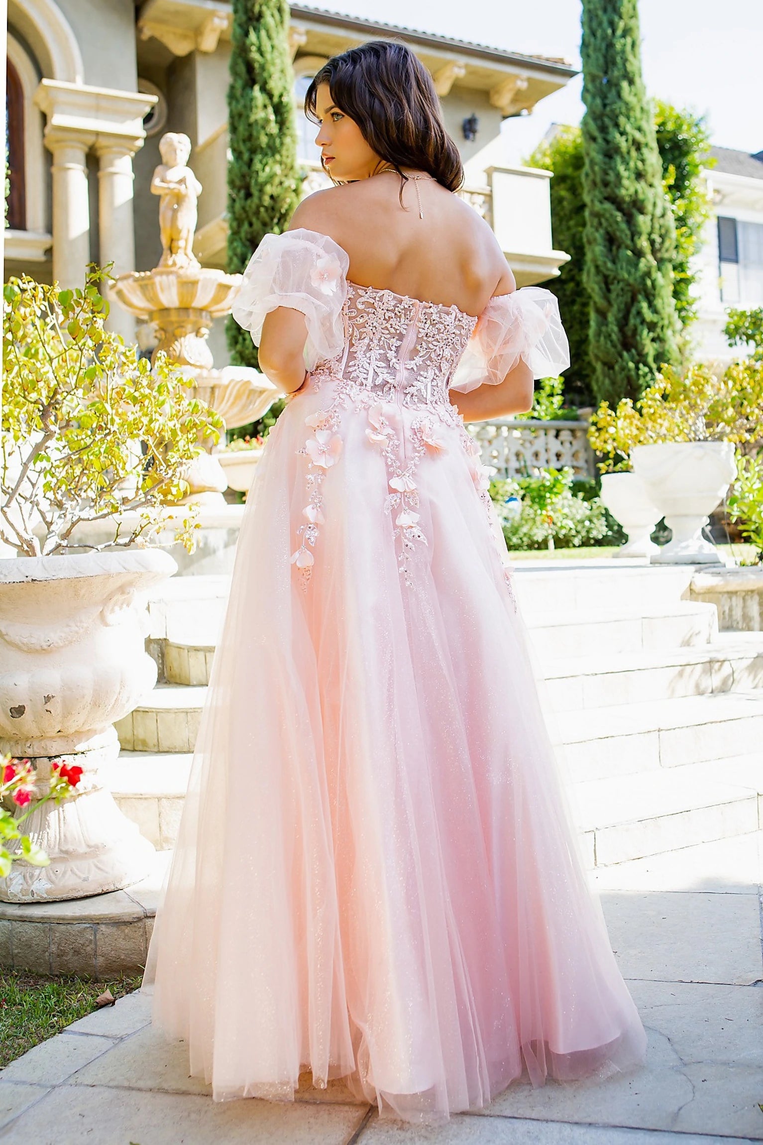 Blush prom dress completed with zipper back closure for fitted finish
