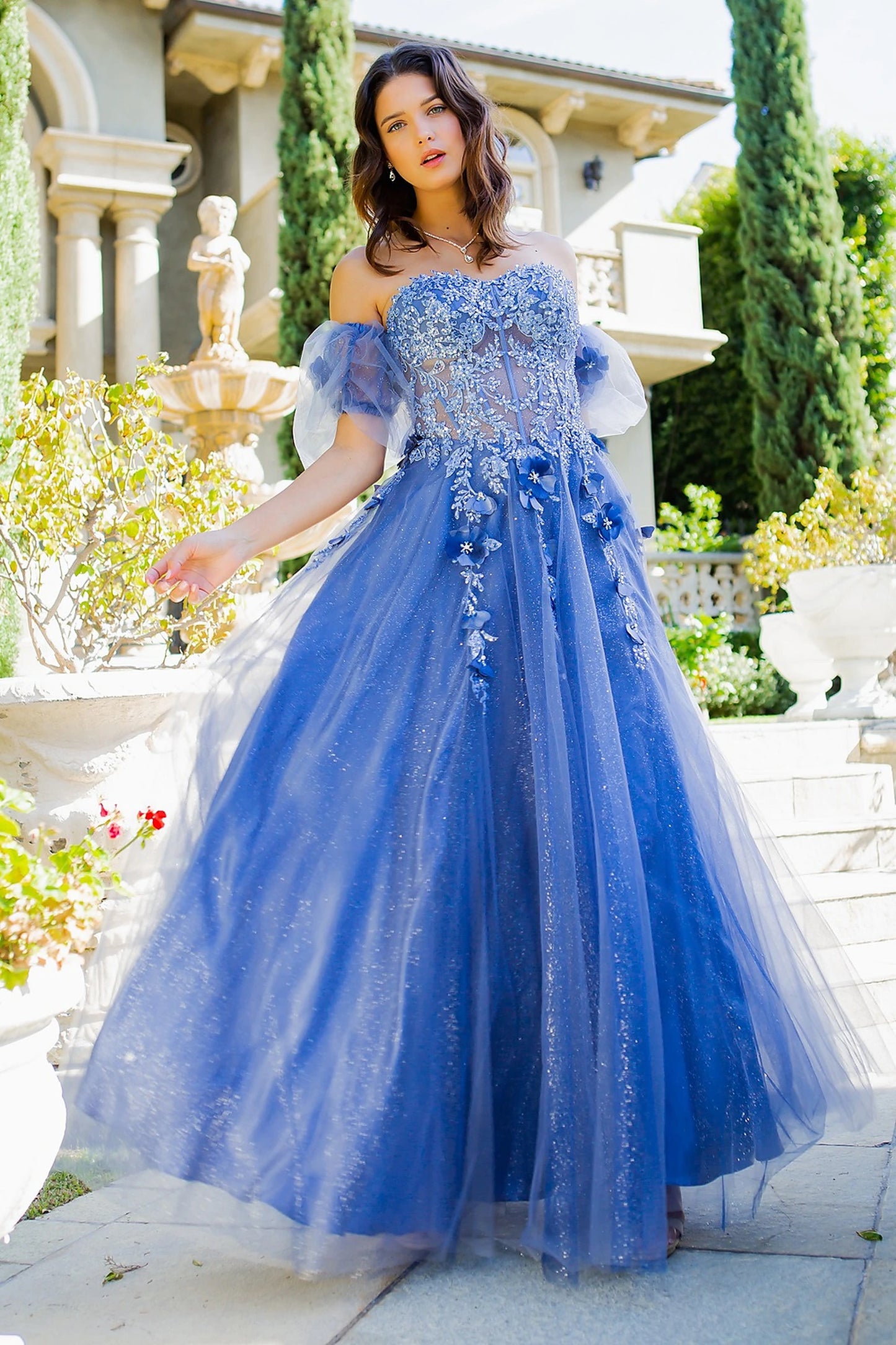 Blue prom dress with corset-fitted bodice and sheer panels