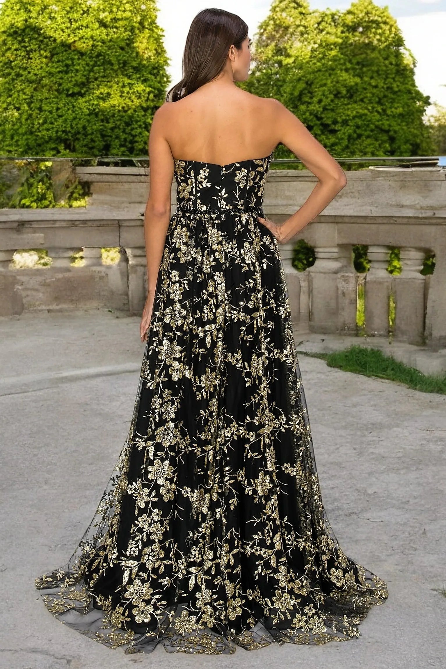 Black evening dress completed with zipper back closure for fitted finish