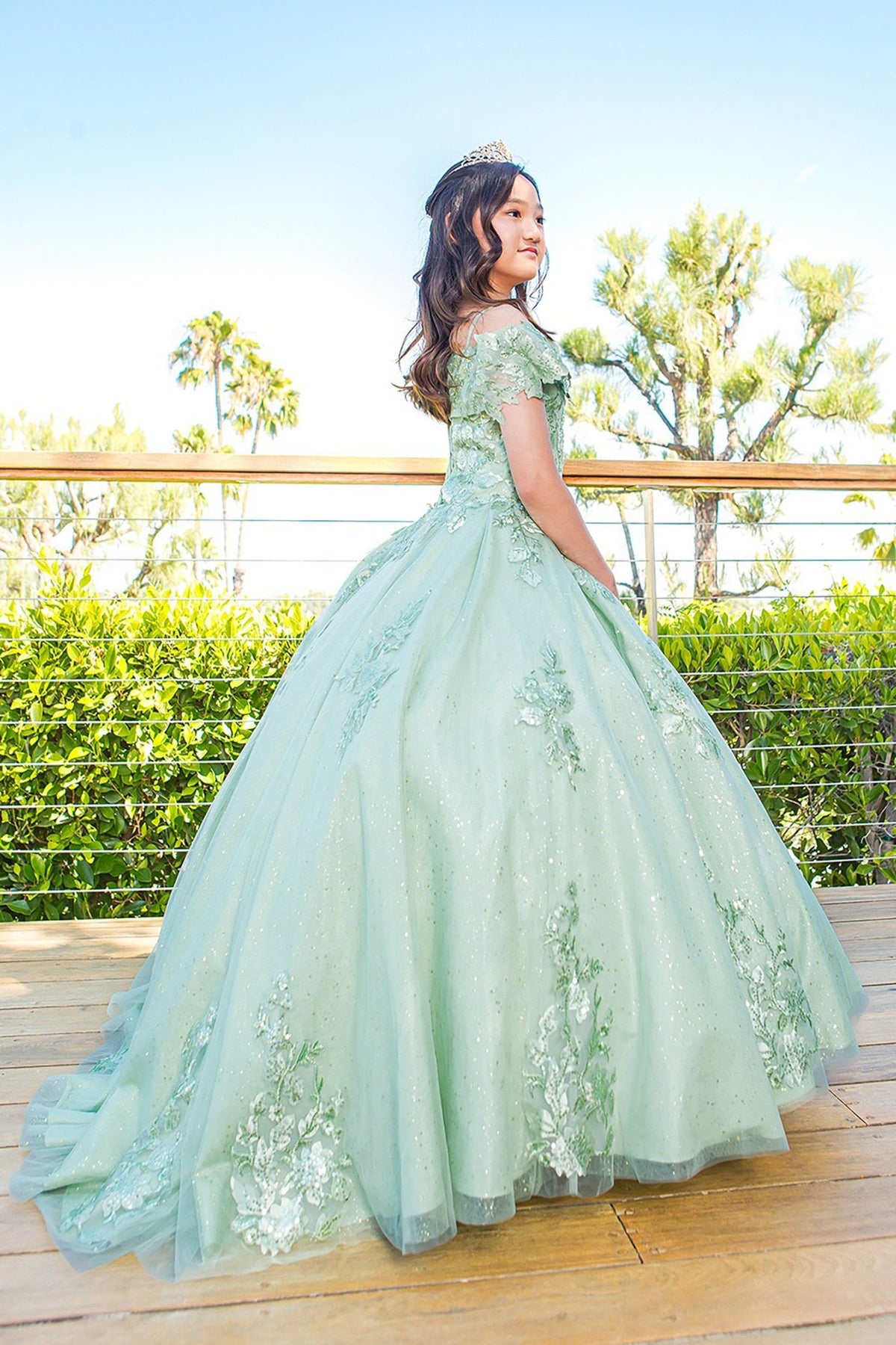 Sage back view kids mini quinceañera mini quince dress with sweetheart neckline, 3D floral sequin applique and glitter lace train.