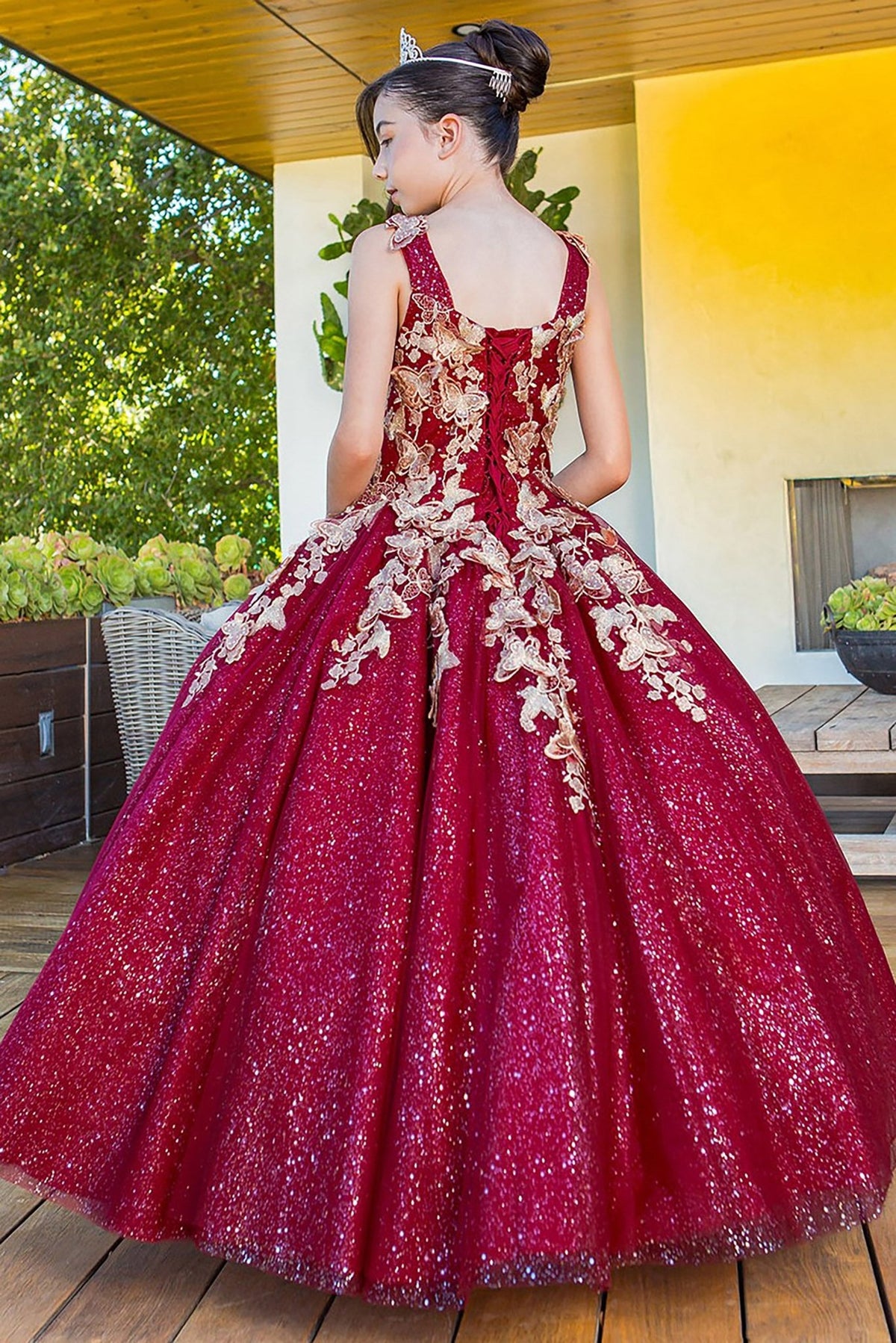 Burgundy mini quince dress with metallic 3D butterfly glitter tulle back view.