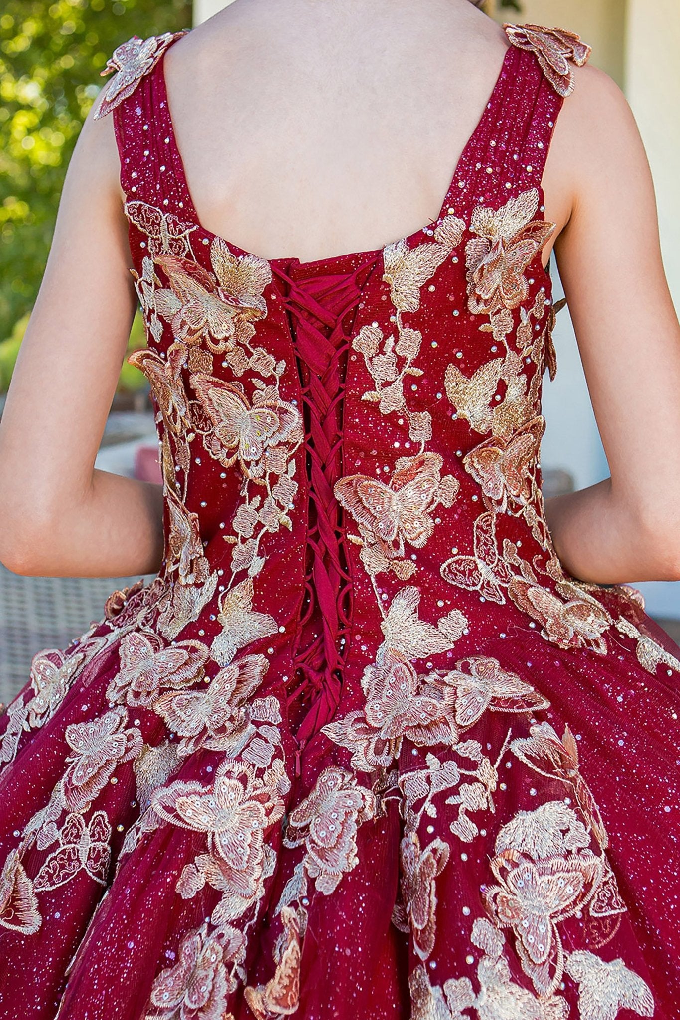 Burgundy mini quince dress with metallic 3D butterfly glitter tulle back zoom detail.