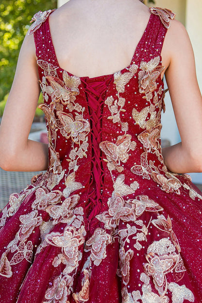 Back detail shows burgundy mini quince dress with metallic 3D butterfly glitter tulle back zoom detail.