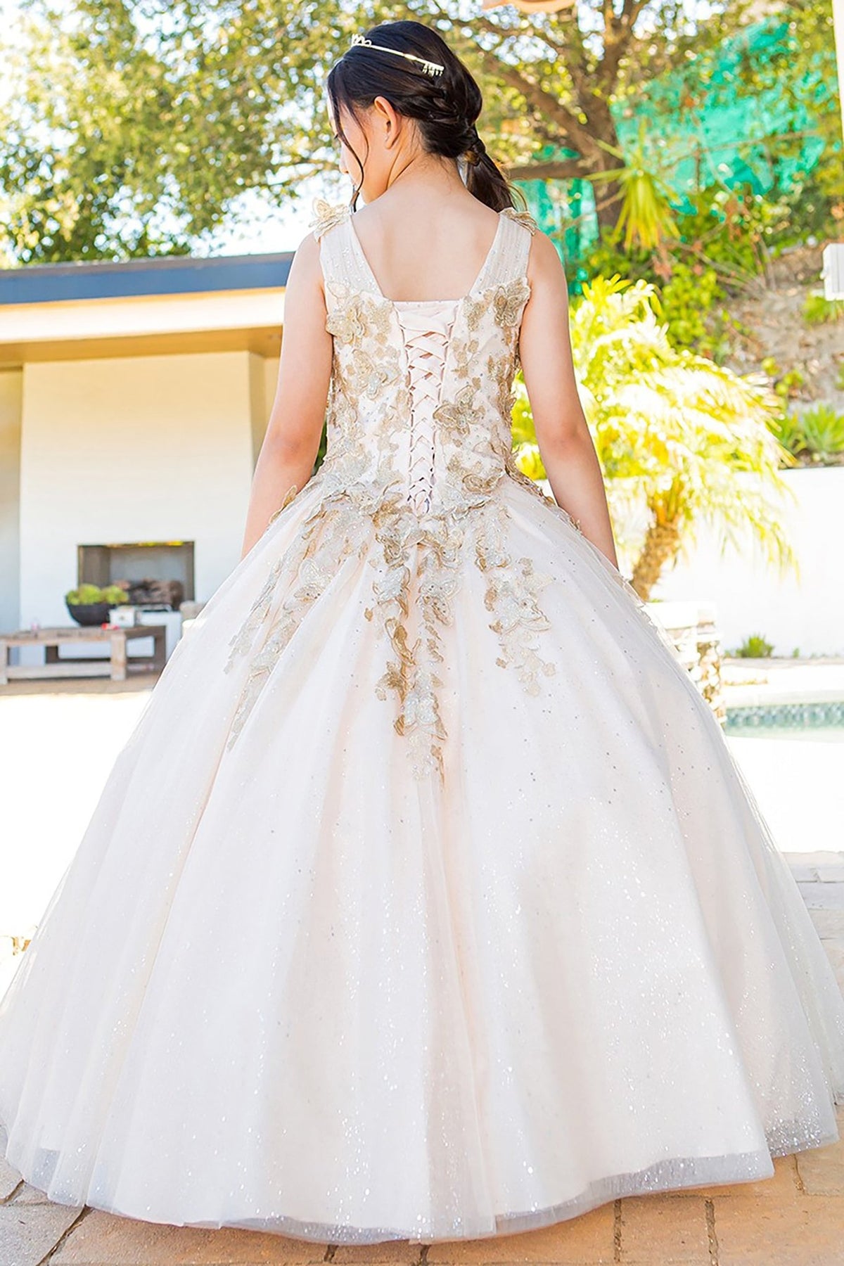 Champagne mini quince dress with metallic 3D butterfly glitter tulle back detail.