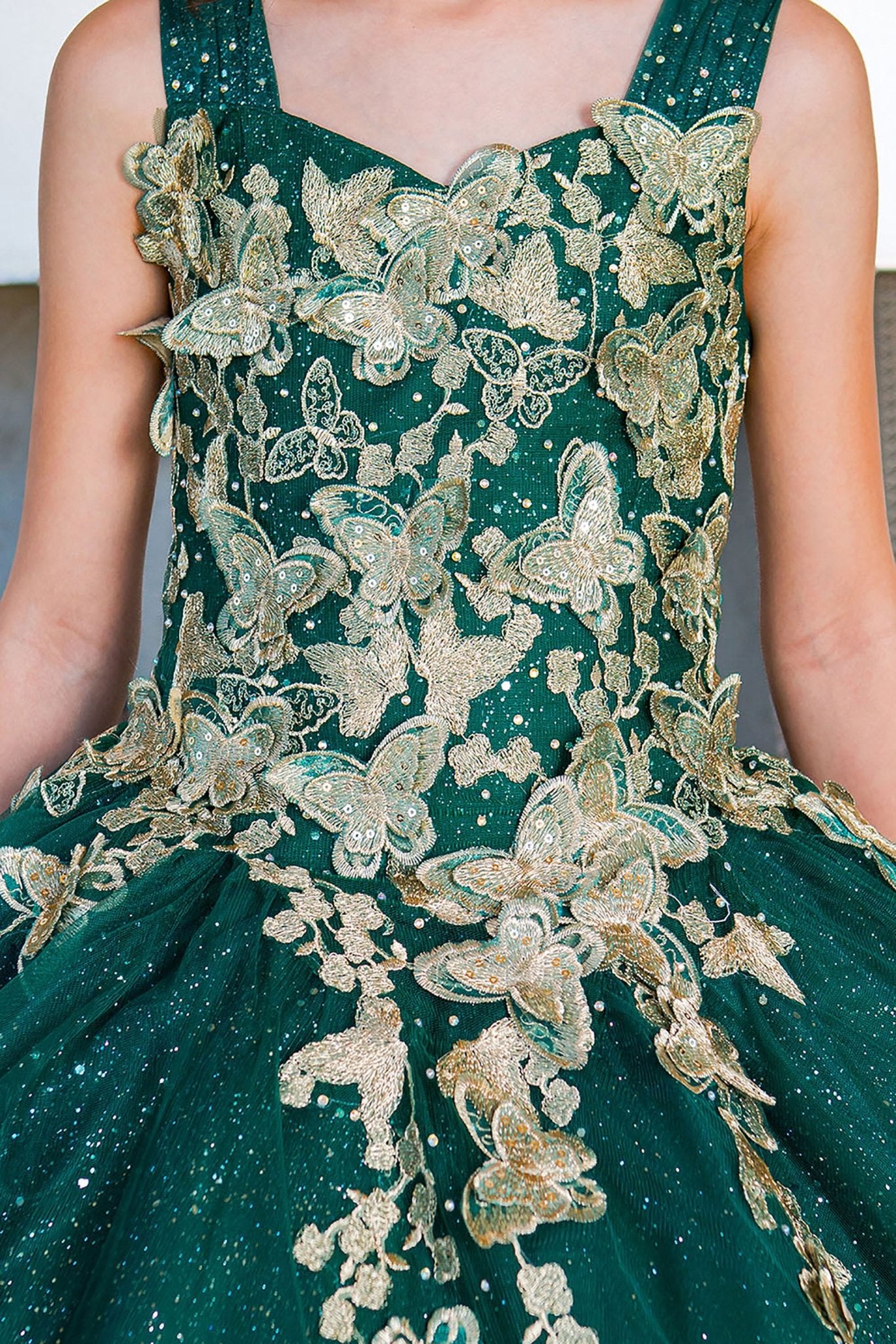 Hunter green mini quince dress with metallic 3D butterfly glitter tulle front zoom detail.