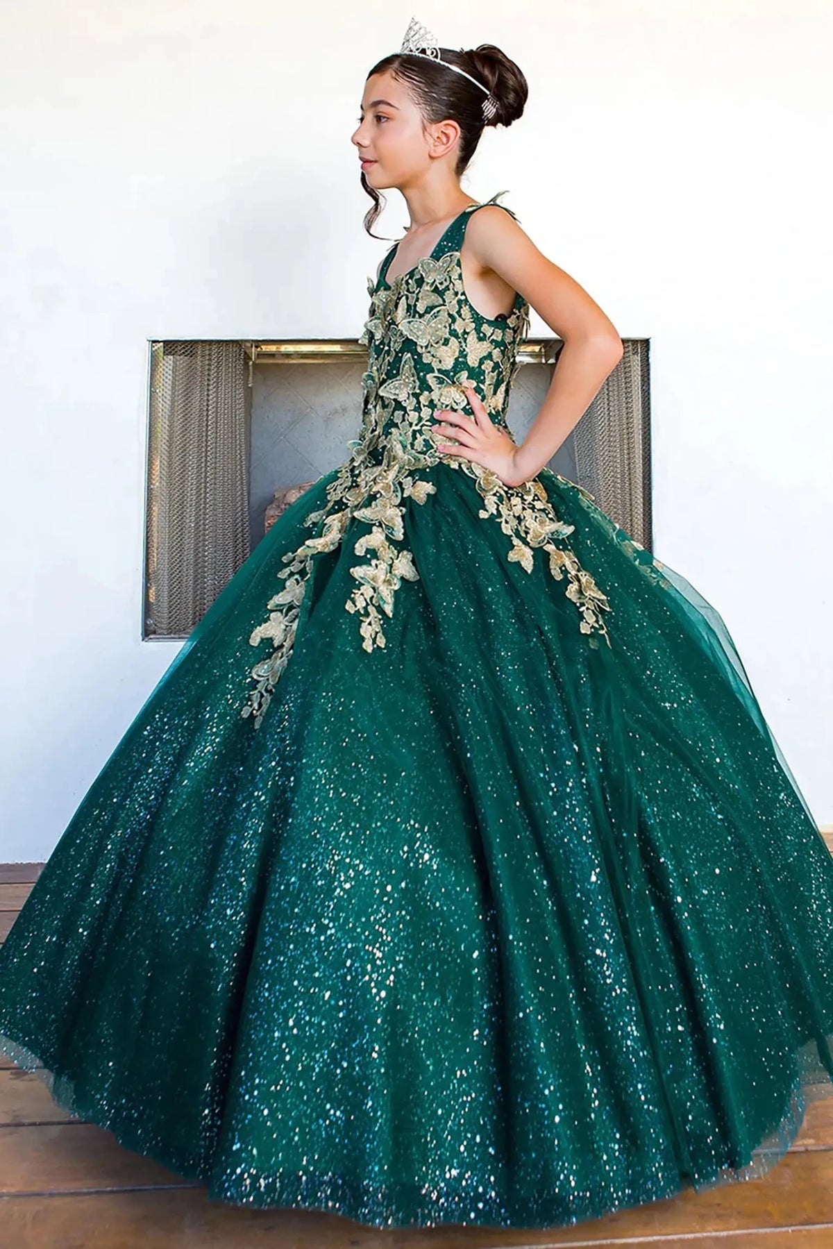Hunter green mini quince dress with metallic 3D butterfly glitter tulle three-quarter view.