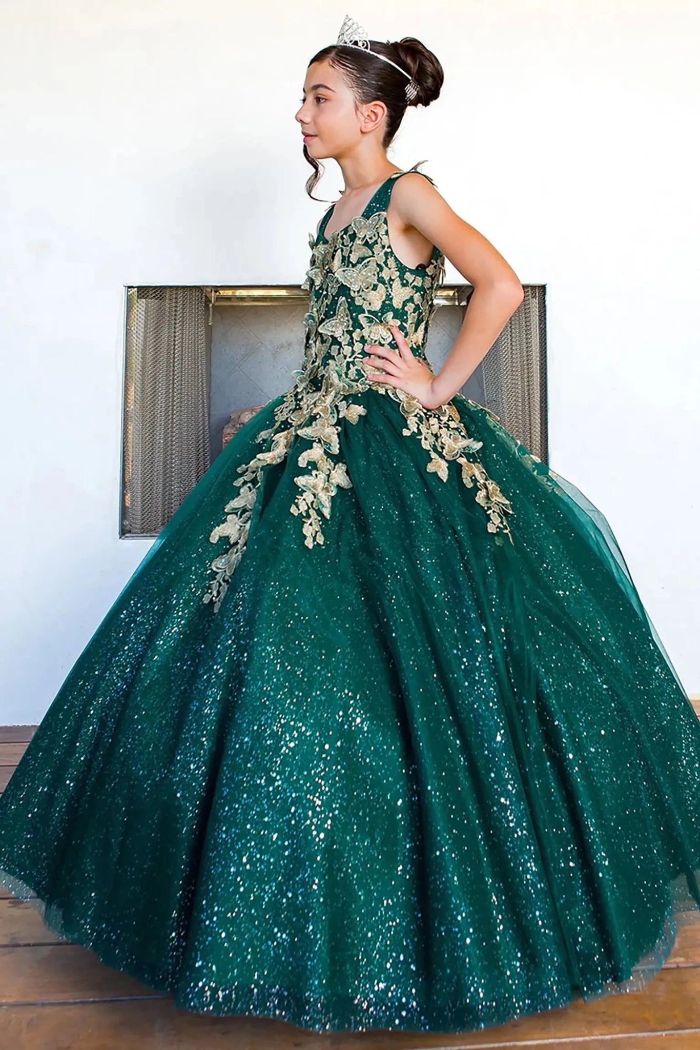 Hunter green mini quince dress with metallic 3D butterfly glitter tulle three-quarter view.