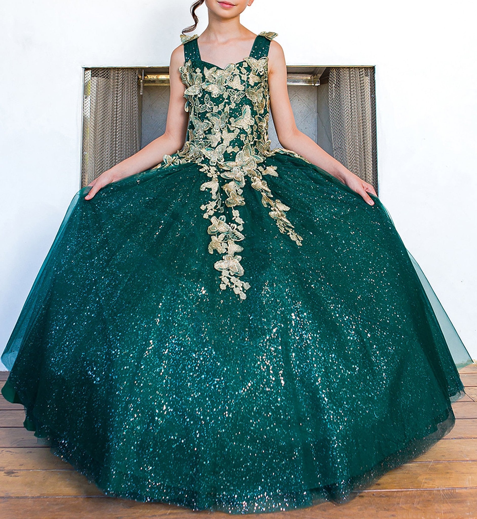 Hunter green mini quince dress with metallic 3D butterfly glitter tulle front detail.