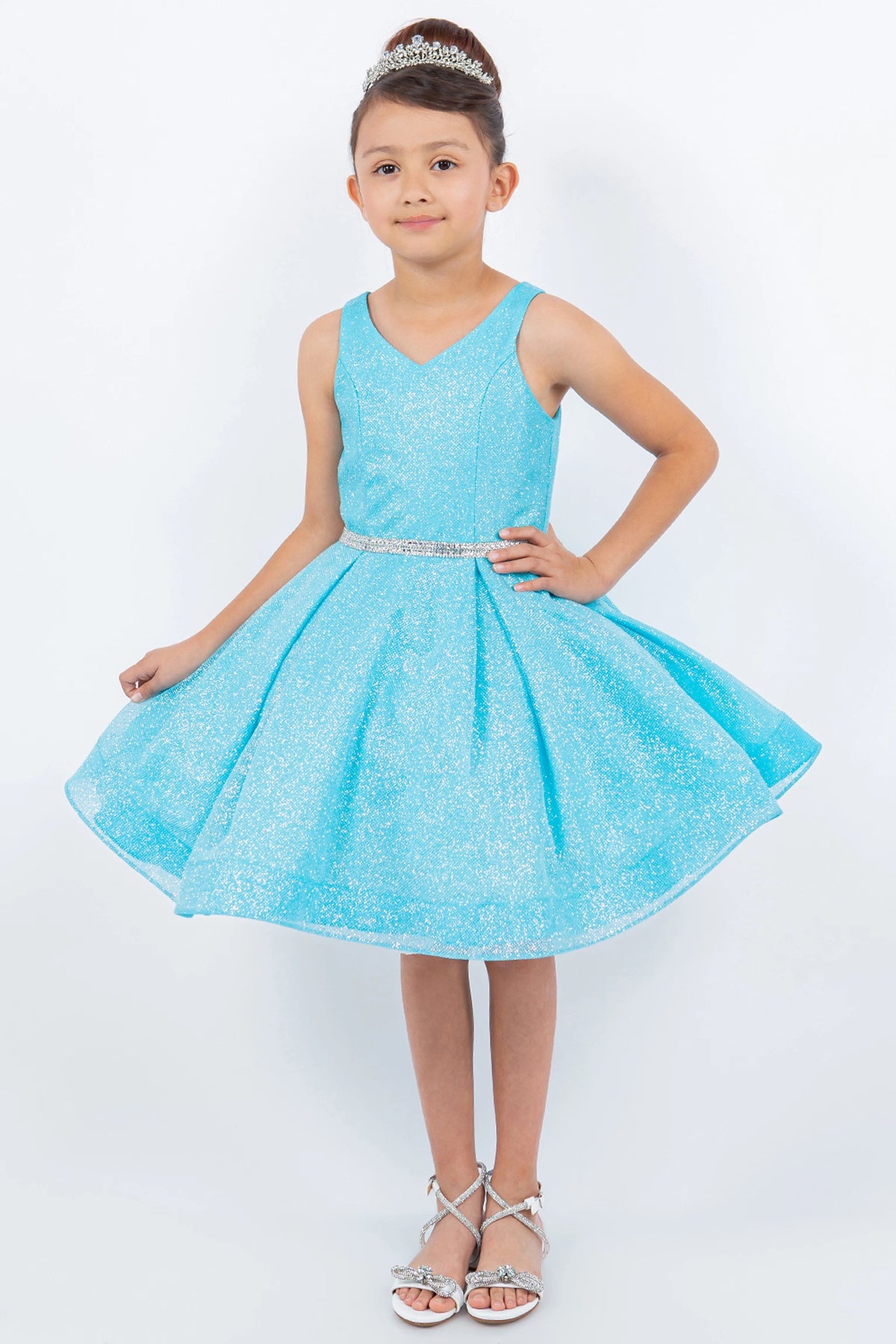 Designed details of a glittered pleated skirt distinguish the Blue kids party dress.