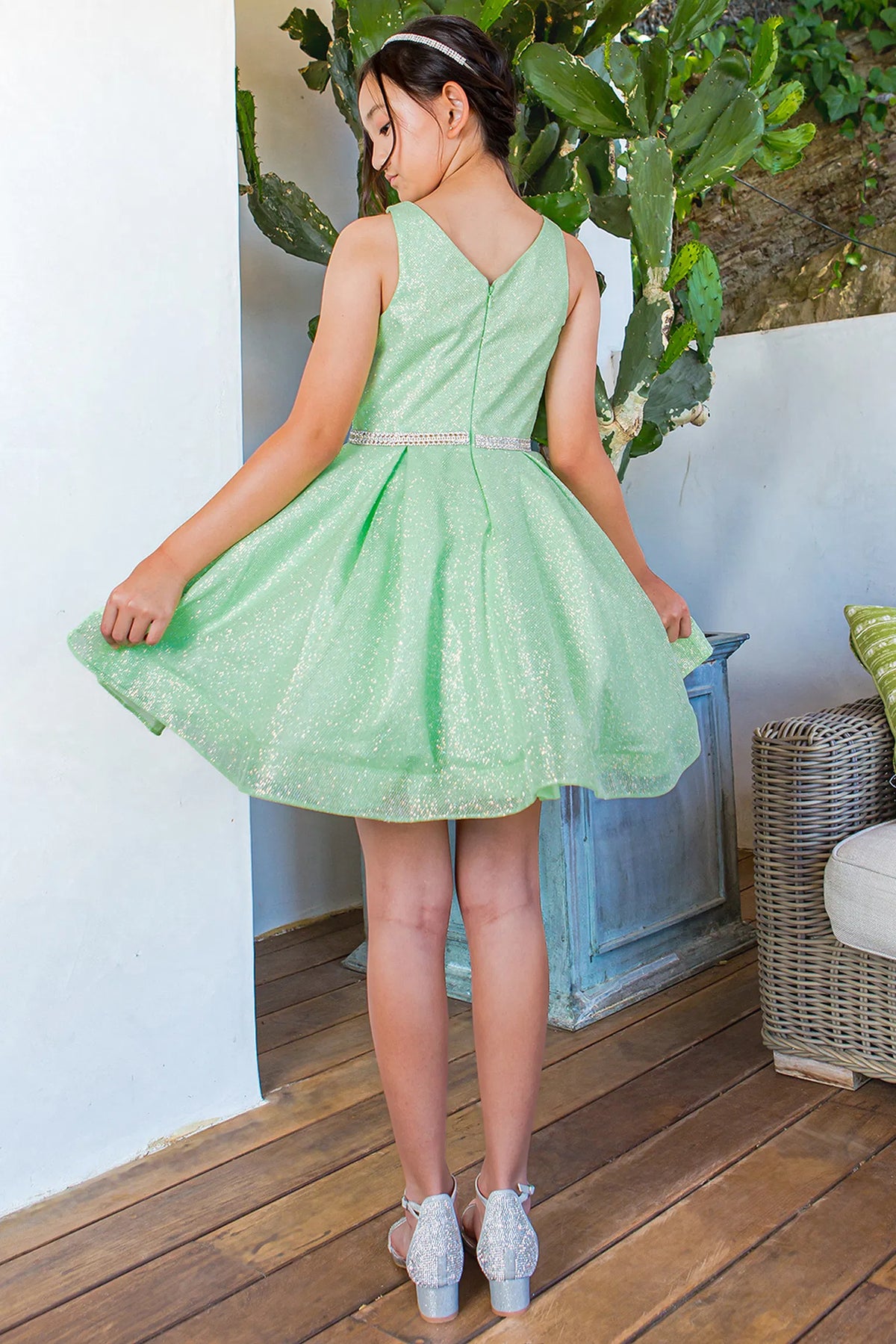 Finished details of a V-shaped back distinguish the Lime kids party dress.