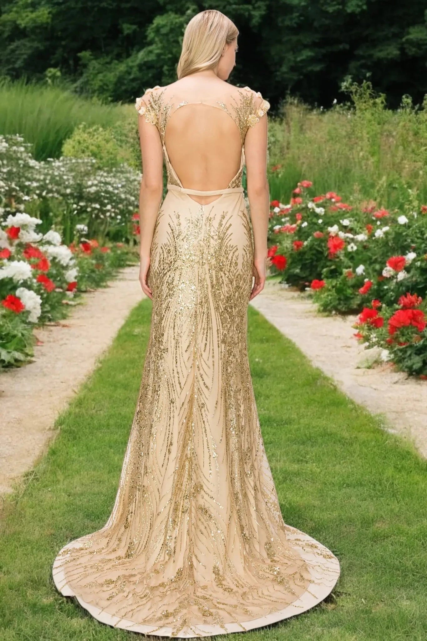 A full back view of a woman wearing a champagne formal dress featuring an elegant open back.