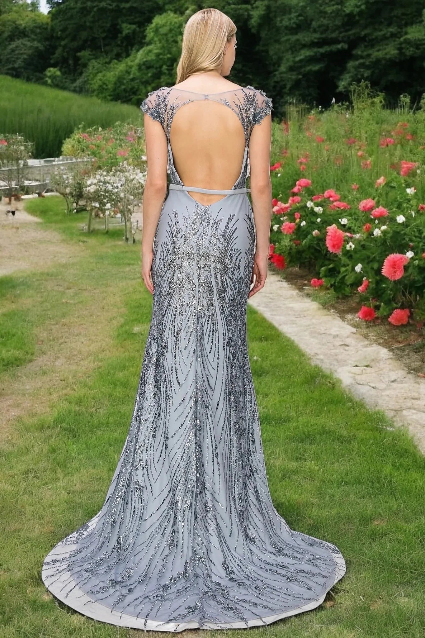 Silver column dress styled with open back construction for secure fit