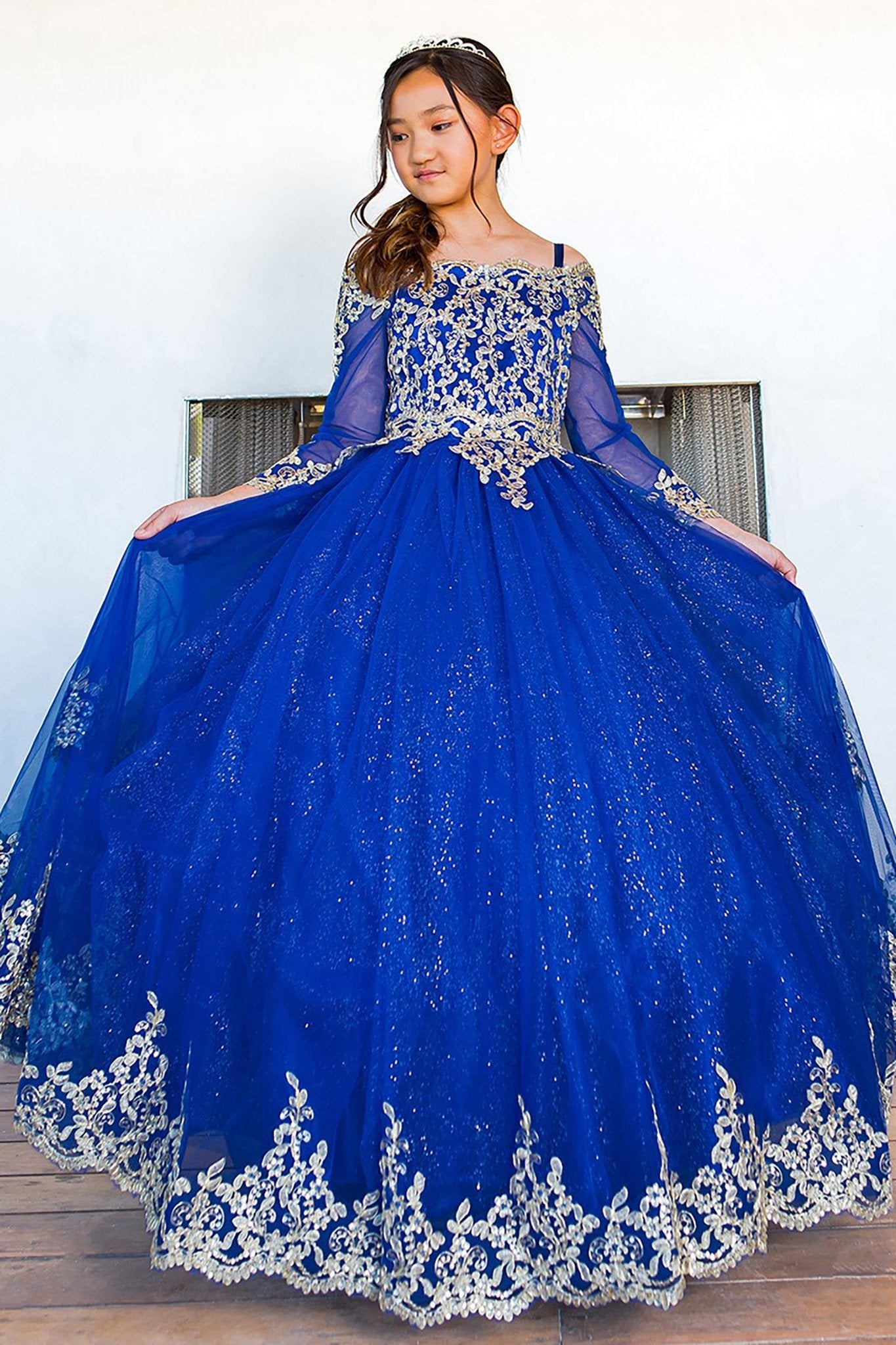 Royal blue mini quince dress with long sleeve off-shoulder glitter tulle.
