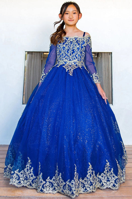 Shown in a front view, the Royal Blue mini quince dress has long sheer sleeves and gold lace over a full glitter skirt.