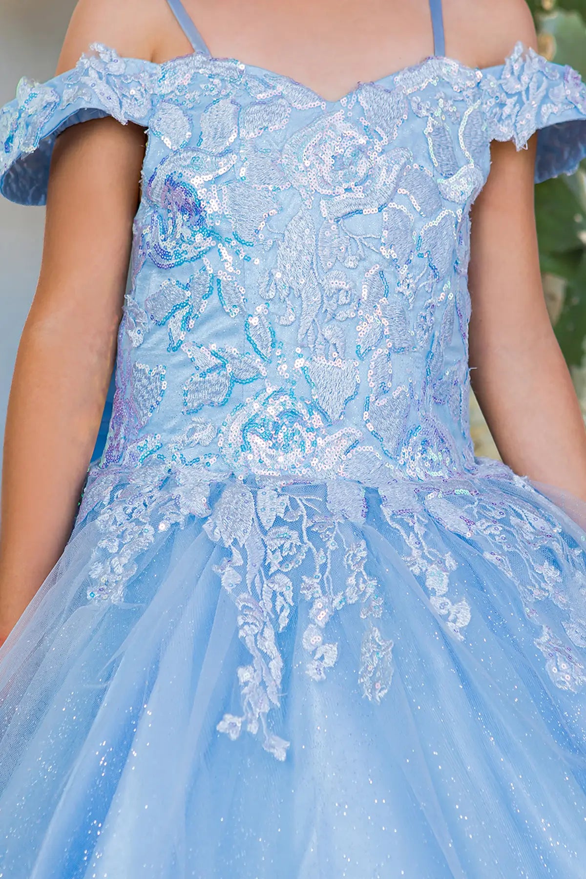 Blue close-up kids mini quinceañera mini quince dress with sequin lace, 3D floral accents and tulle fabric.