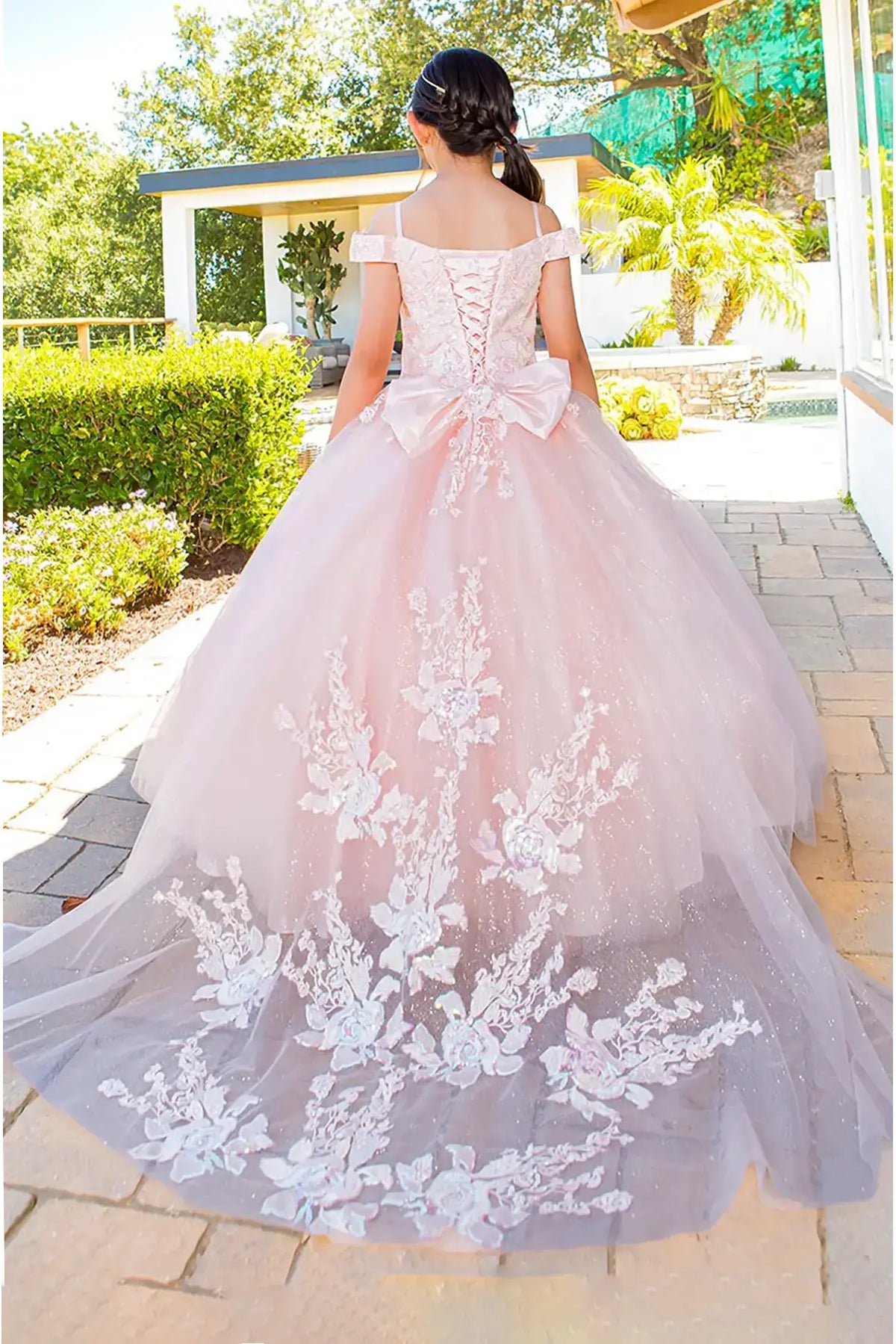 Blush front view kids mini quinceañera mini quince dress with off-shoulder top, 3D floral lace, puffy tulle skirt and bow.