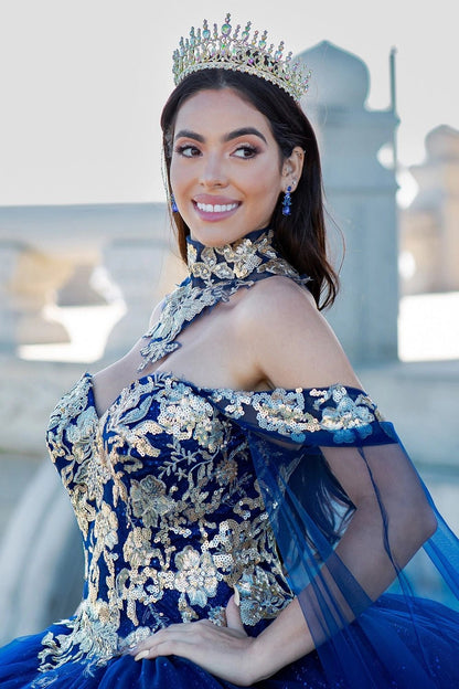 Shown in a bodice detail, the Navy quinceañera dress has gold floral collar, shoulder straps and embroidered bodice.